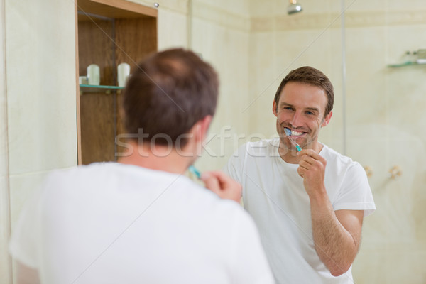 Man brushing his teeth Stock photo © wavebreak_media