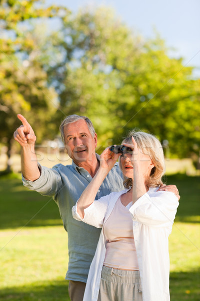 Couple looking at the sky with their binoculars Stock photo © wavebreak_media