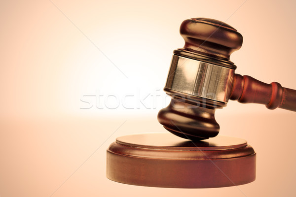 Close up of a brown gavel against a lighted background Stock photo © wavebreak_media