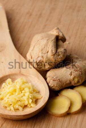 Close up of different forms of ginger against a wood worktop Stock photo © wavebreak_media