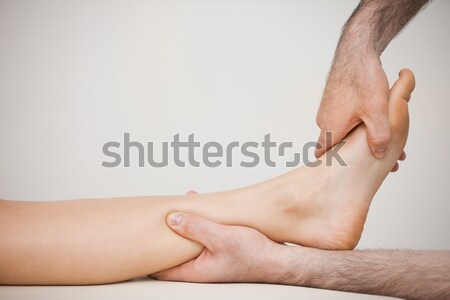 Side view of a foot being massaged in a medical room Stock photo © wavebreak_media
