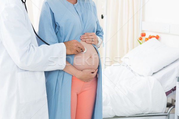 Doctor checking pregnant woman with stethoscope Stock photo © wavebreak_media