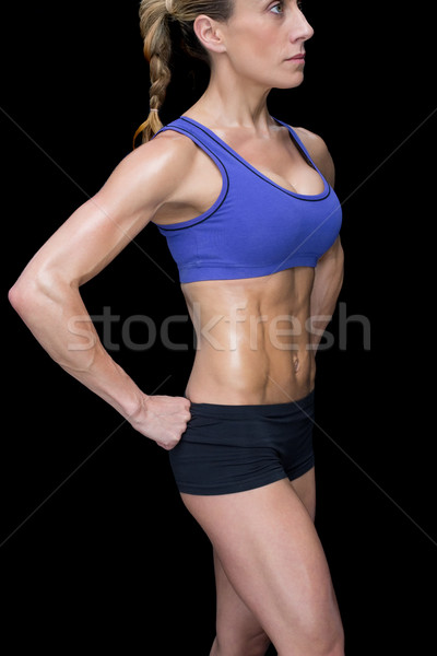 Silne kobieta stwarzające sportowe biustonosz szorty Zdjęcia stock © wavebreak_media