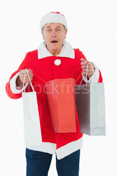Festive man holding shopping bags Stock photo © wavebreak_media
