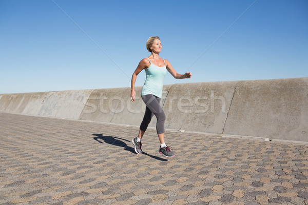 Aktív idős nő jogging móló napos idő Stock fotó © wavebreak_media