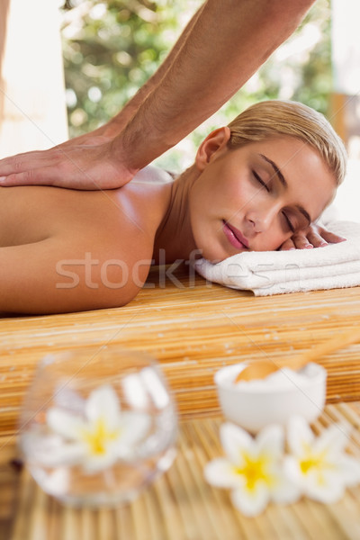 Stock photo: Woman receiving back massage at spa center