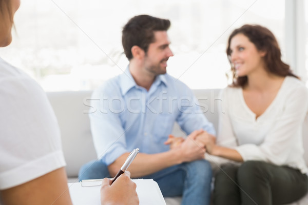 Pareja sonriendo otro terapeuta oficina feliz Foto stock © wavebreak_media