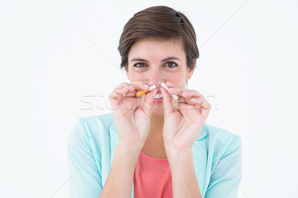 Brunette breaking a cigarette Stock photo © wavebreak_media