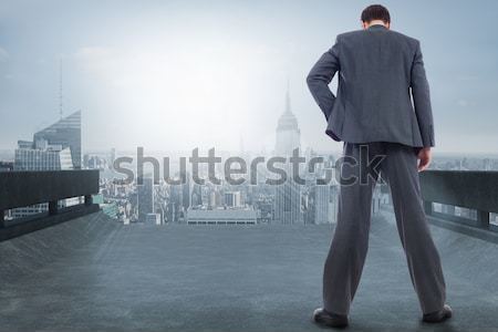 Composite image of rear view of classy young businessman posing Stock photo © wavebreak_media