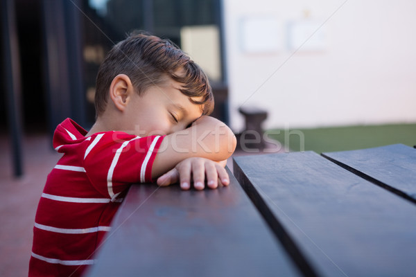 Close up of boy sleeping on table Stock photo © wavebreak_media