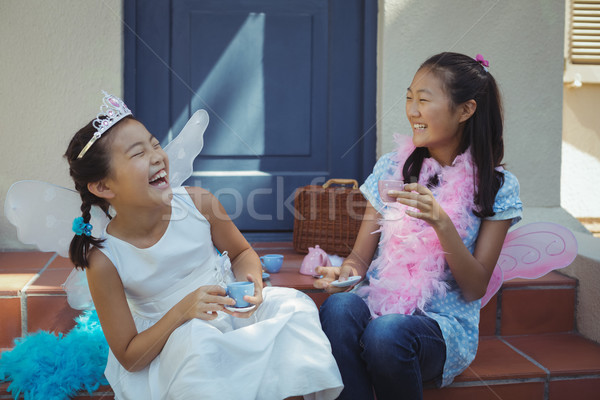 Siblings in fairy costume having a tea party Stock photo © wavebreak_media