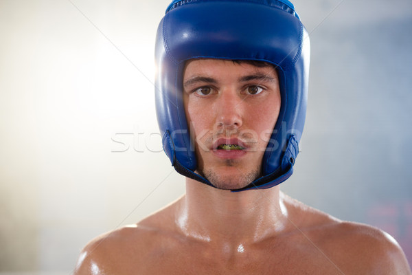 Close-up portrait of young male boxer wearing blue headgear Stock photo © wavebreak_media