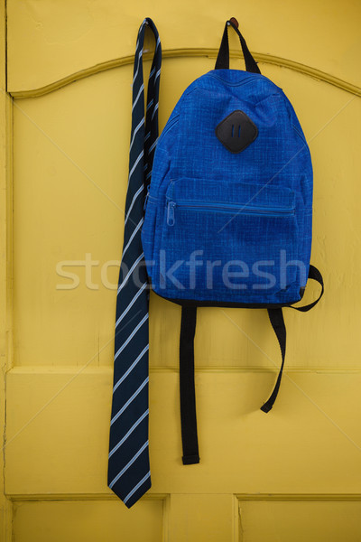 Schoolbag and tie hanging on door Stock photo © wavebreak_media