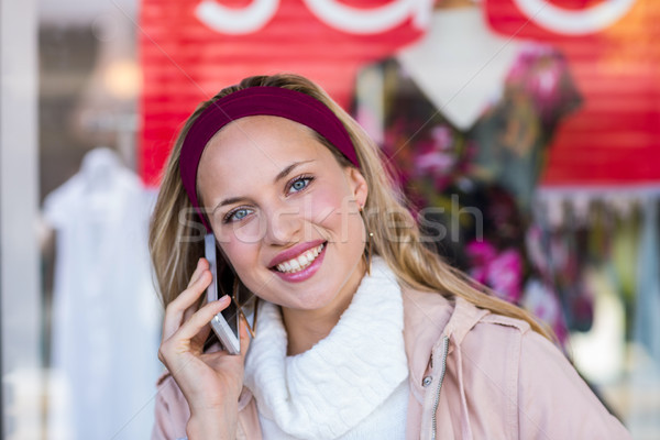 Smiling woman phoning with smartphone Stock photo © wavebreak_media