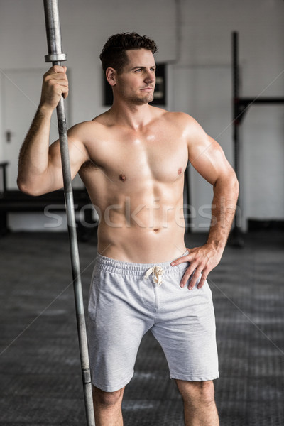 Muscular man holding barbell Stock photo © wavebreak_media