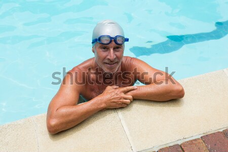 Jóképű férfi pihen perem medence víz férfi Stock fotó © wavebreak_media