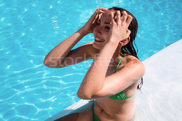 Portrait of smiling woman in swimming pool Stock photo © wavebreak_media