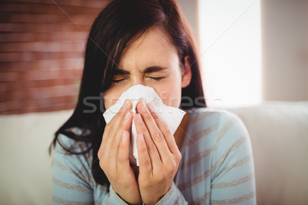 Stock photo: Close-up of woman sneezing