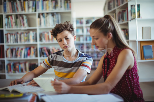 Classmates using digital tablet in library Stock photo © wavebreak_media