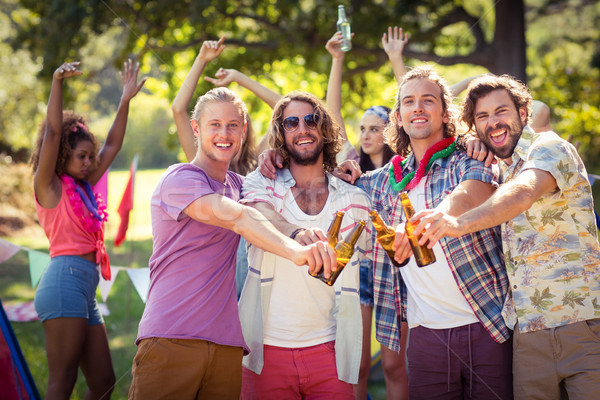 Mutlu arkadaşlar bira şişeler Stok fotoğraf © wavebreak_media