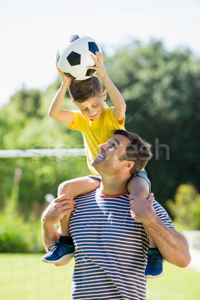 Smiling father carrying his son on shoulder Stock photo © wavebreak_media