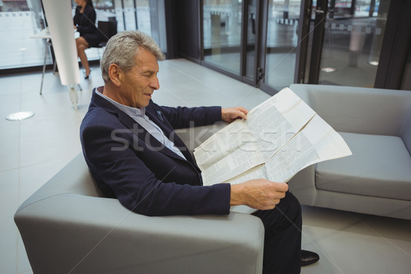 Businessman reading newspaper while sitting Stock photo © wavebreak_media