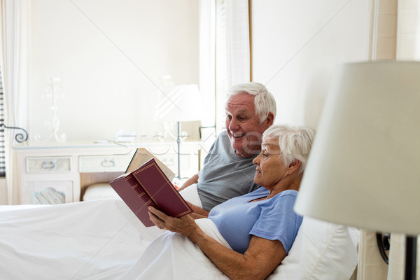 Senior couple reading books in the bedroom Stock photo © wavebreak_media