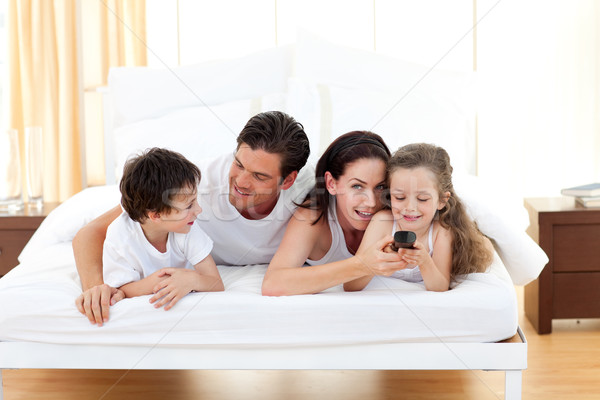 Happy Family Having Fun In The Bedroom Stock Photo