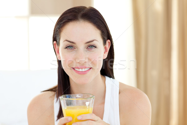Gyönyörű nő iszik narancslé ül ágy lány Stock fotó © wavebreak_media