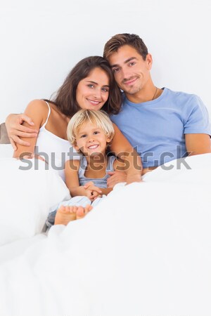Smiling couple watching tv at home Stock photo © wavebreak_media