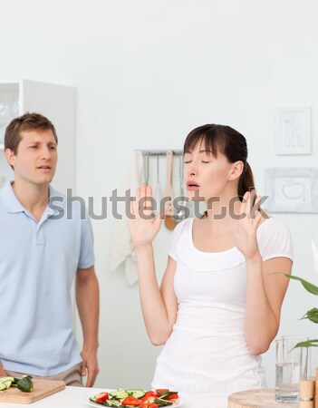 Young couple pointing at each other against a white background Stock photo © wavebreak_media