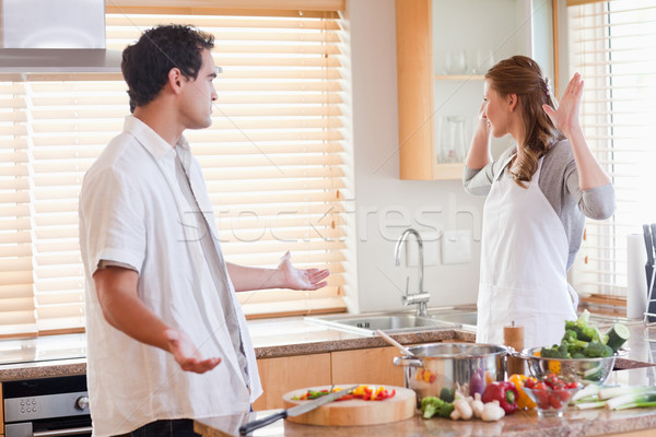 Stock photo: Young couple disputing in the kitchen