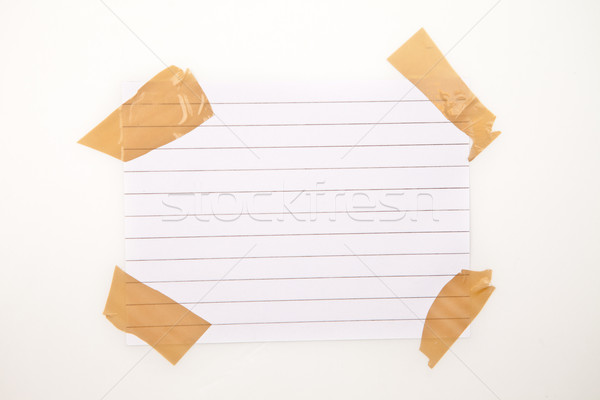 Page vierge ruban adhésif blanche papier stylo portable [[stock_photo]] © wavebreak_media