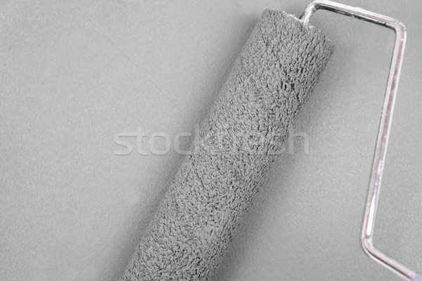 Grey background with a paint roller in the middle Stock photo © wavebreak_media