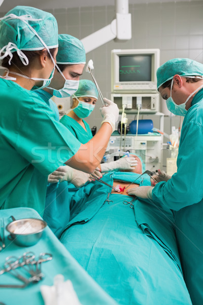 Nurse mopping the brow of a surgeon in an operating theatre Stock photo © wavebreak_media