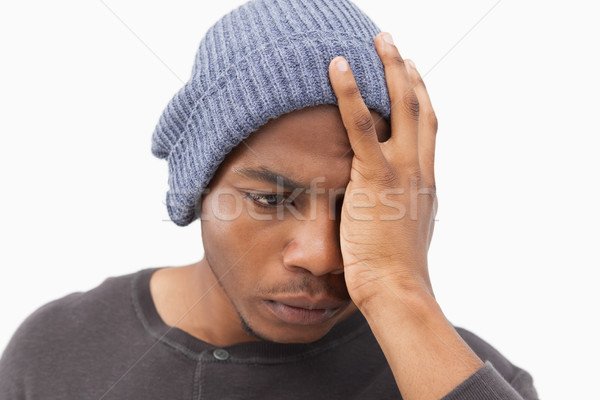 Depressed man in beanie hat Stock photo © wavebreak_media