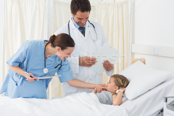 Doctors examining sick girl Stock photo © wavebreak_media