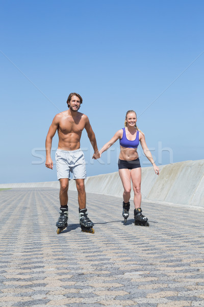 Fit couple rollerblading together on the promenade  Stock photo © wavebreak_media