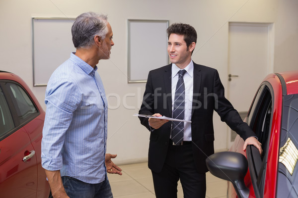 Smiling businessman speaking with his customer Stock photo © wavebreak_media