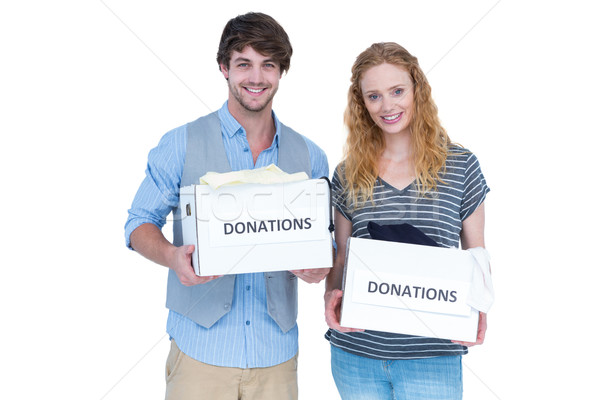  Smiling young couple carrying donation box Stock photo © wavebreak_media