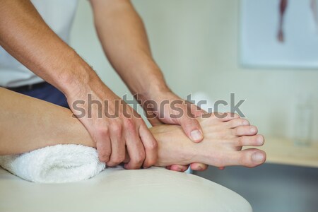 Pedicurist massaging a customers foot Stock photo © wavebreak_media