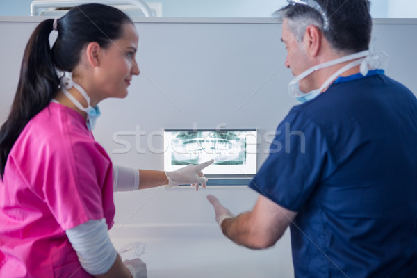 Dentist and assistant looking at x-ray together Stock photo © wavebreak_media