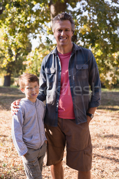 Portrait of happy man and boy standing in forest Stock photo © wavebreak_media