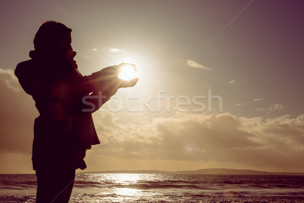 Woman holding the light of the sun  Stock photo © wavebreak_media