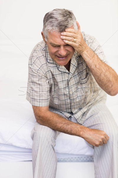 Suffering senior man touching his forehead Stock photo © wavebreak_media