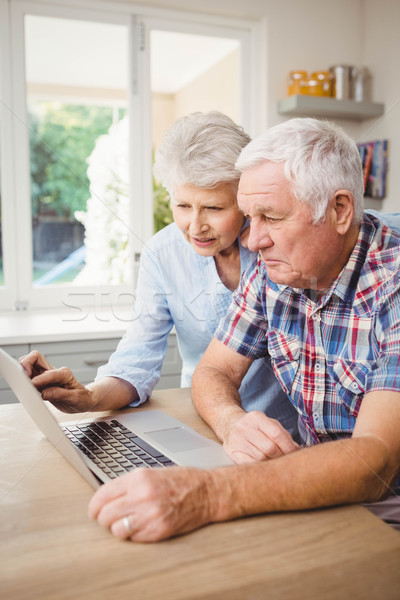 Stock photo: Senior couple using laptop