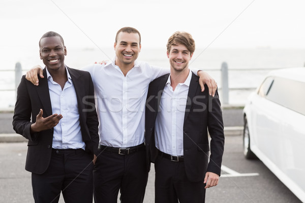 Bonito homens posando limusine feliz Foto stock © wavebreak_media