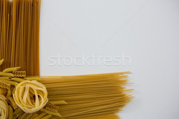 Varieties of pasta arranged on white background Stock photo © wavebreak_media