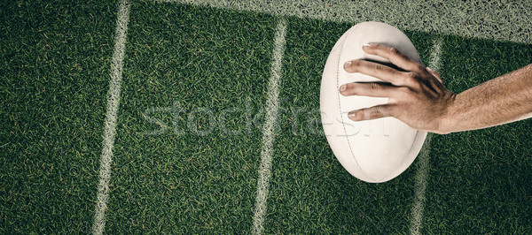 Stock photo: Composite image of cropped image of sports player holding ball