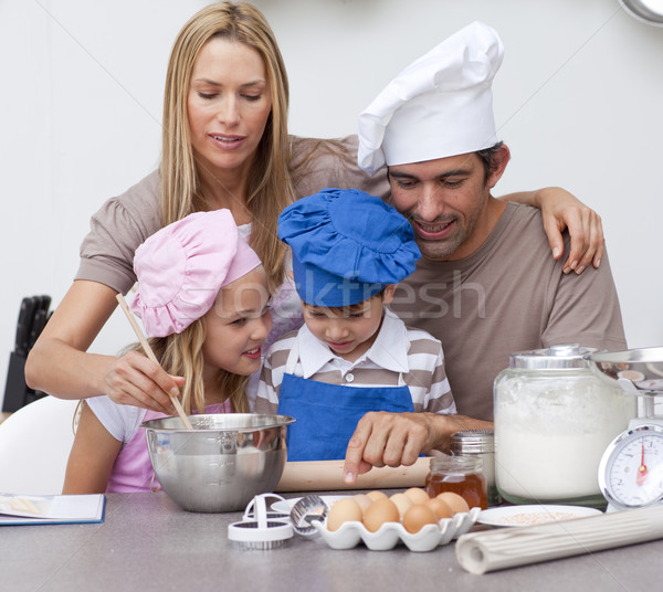 Children baking cookies with their parents Stock photo © wavebreak_media